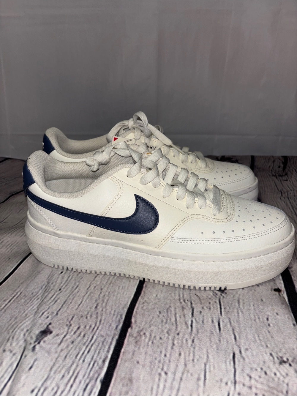 Nike Men’s White Leather Sneakers with Navy Swoosh Accent